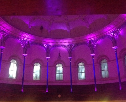 Uplighting pillars at a wedding.